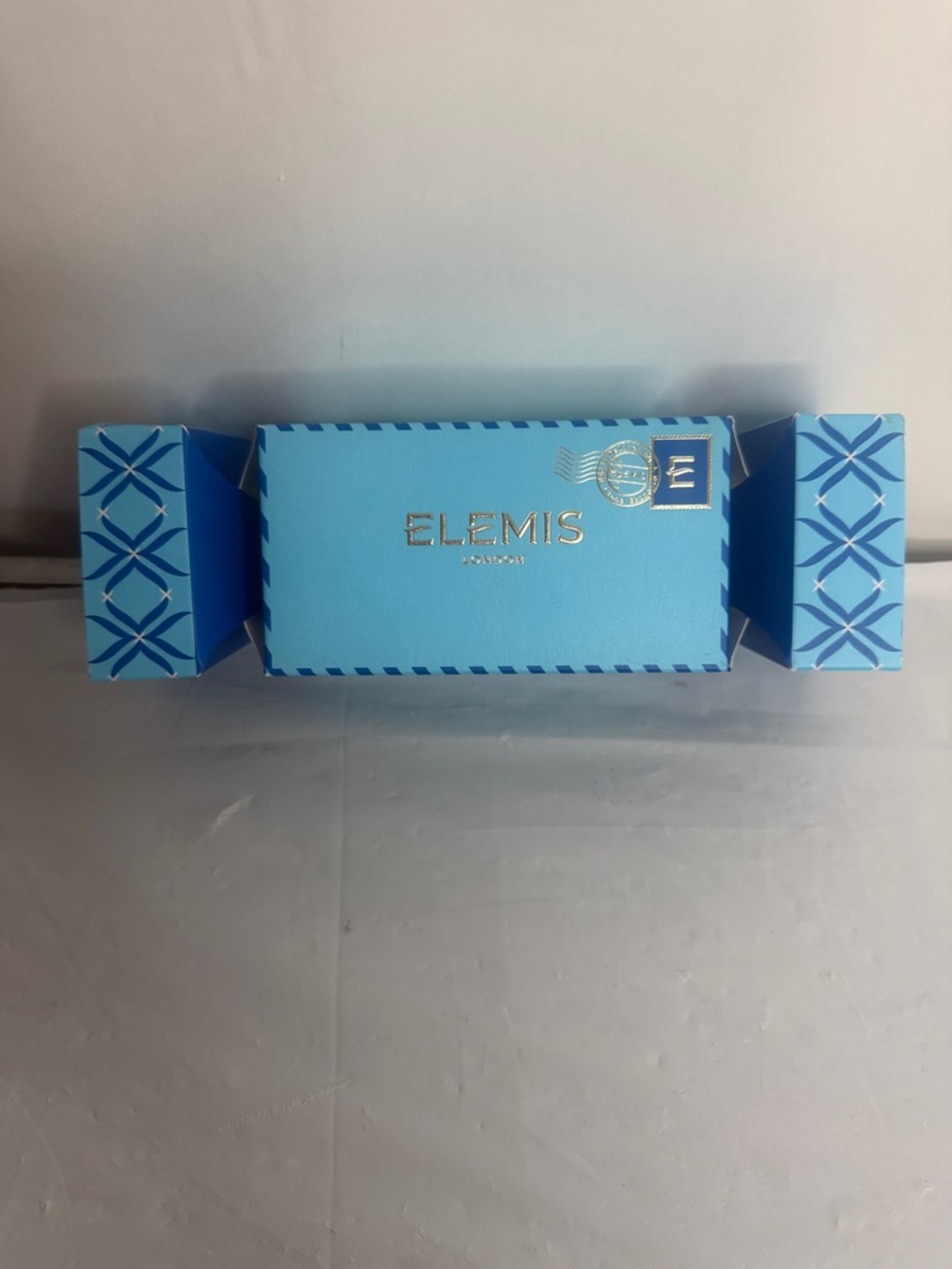 ELEMIS Light Blue Holiday Gift Cracker with Gold Foil Logo
